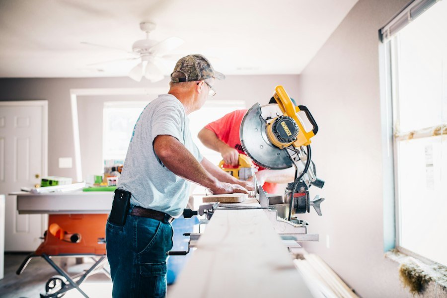 Carpenter standing in front of a miter saw